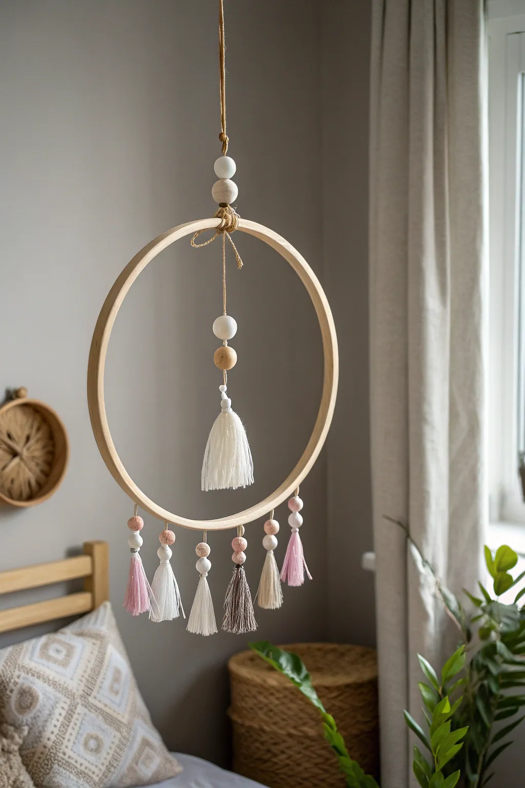 Elevate your space with a touch of minimalist elegance through this handcrafted hoop mobile.