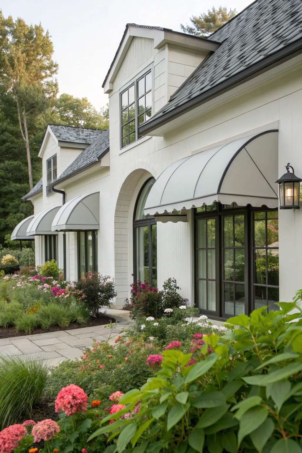 Elegant arched awnings bring a timeless charm to this farmhouse.