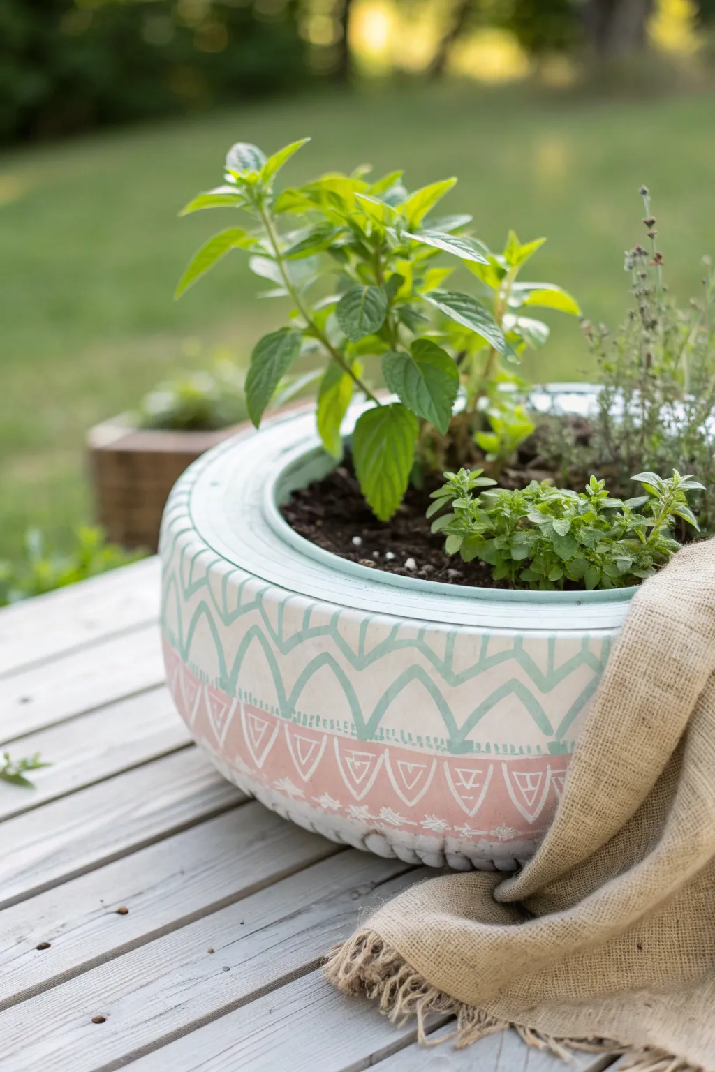 Breathe new life into your garden with these chic upcycled tire planters filled with fresh herbs! #EcoChic #HerbGarden