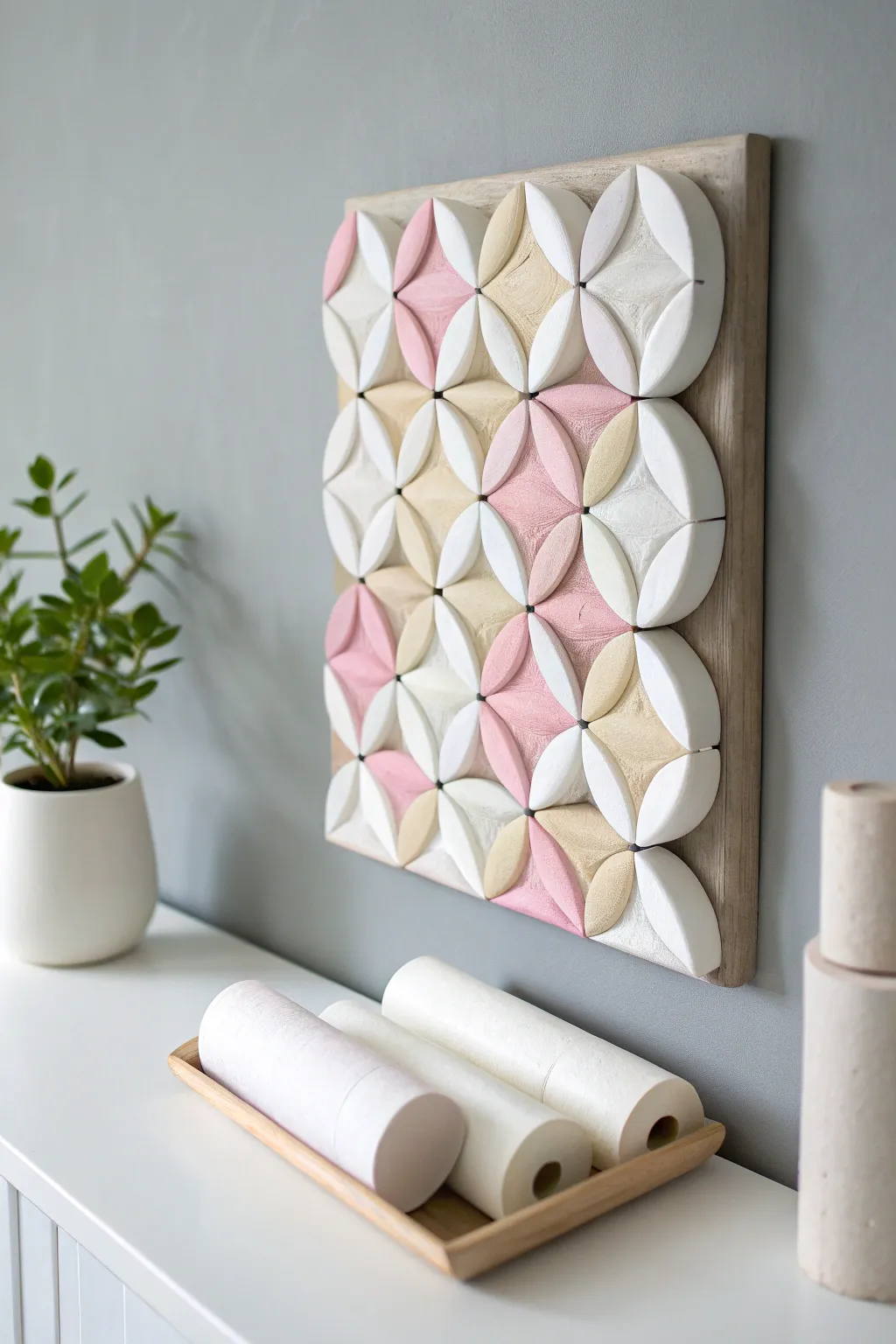 Transform humble toilet rolls into stunning geometric wall art with a touch of Scandinavian elegance. #EcoChic #MinimalistDecor