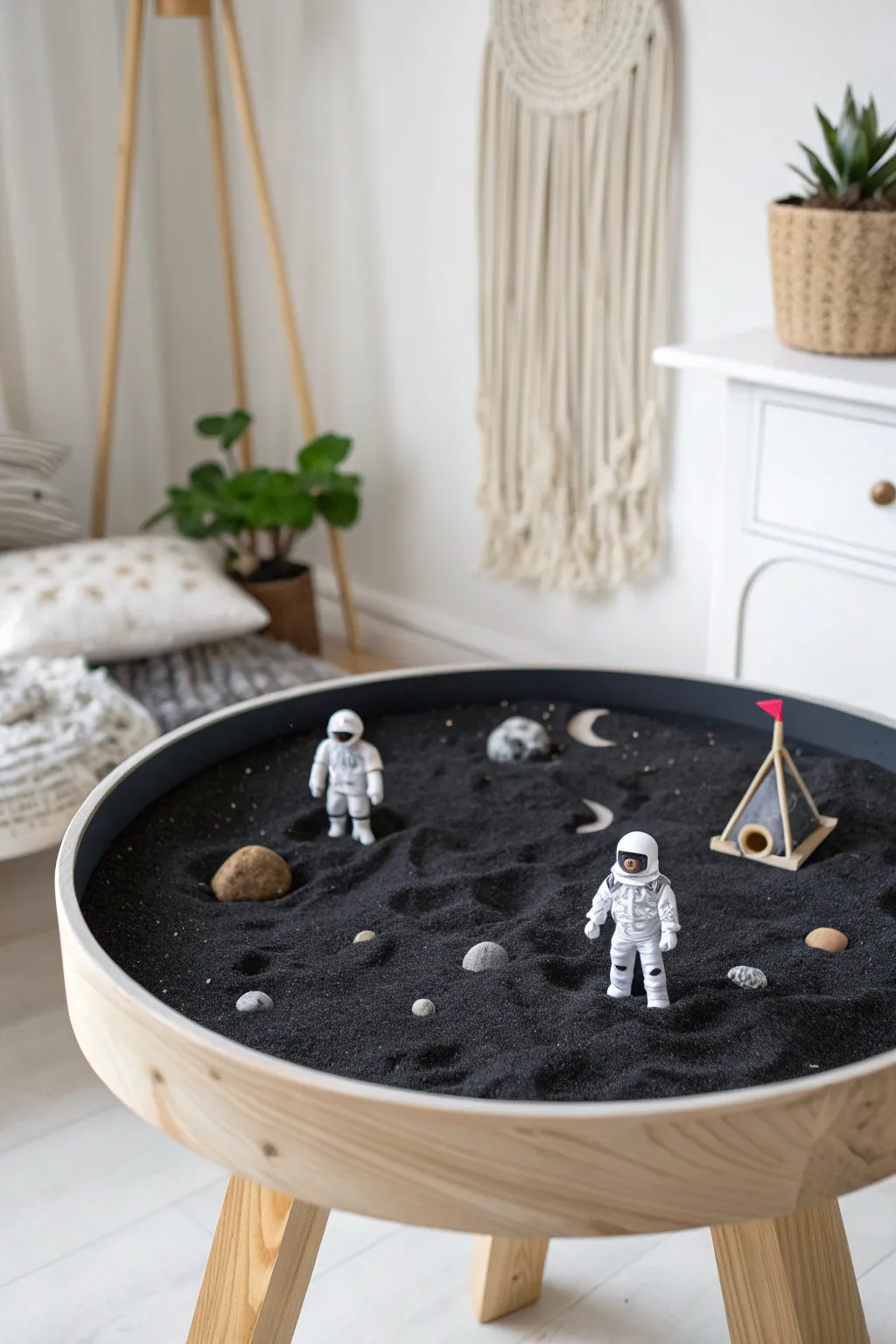 Craft a cosmic adventure in a minimalist lunar landscape. Unleash imagination with every grain of black sand!