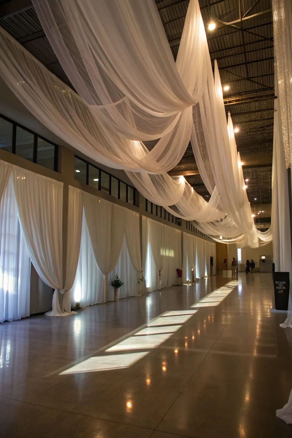Sheer drapes hang gracefully, adding a whimsical and elegant touch to the room.