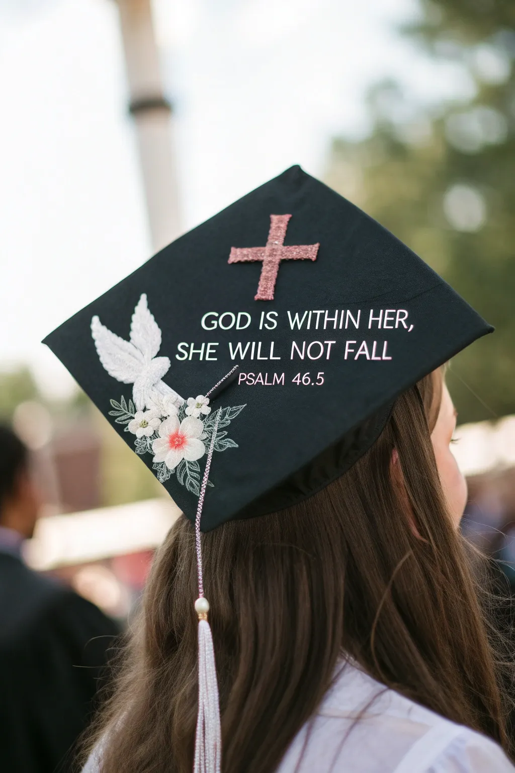 Embrace your faith and strength on graduation day with this beautifully crafted cap design.