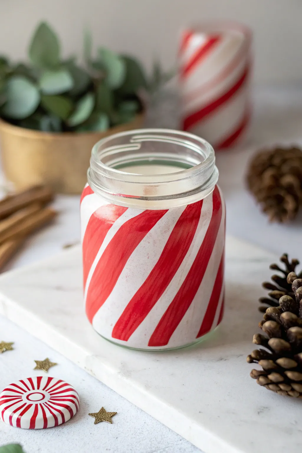 Elevate your holiday gifting with this chic candy cane-inspired jar, a perfect blend of Scandinavian minimalism and boho charm.