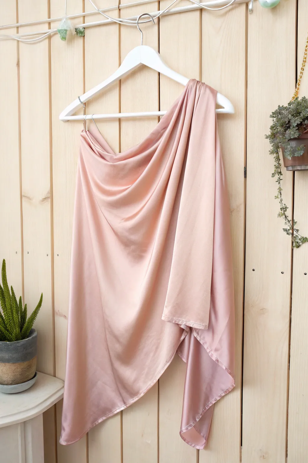 Elevate your style with the effortless grace of an asymmetrical silk top.