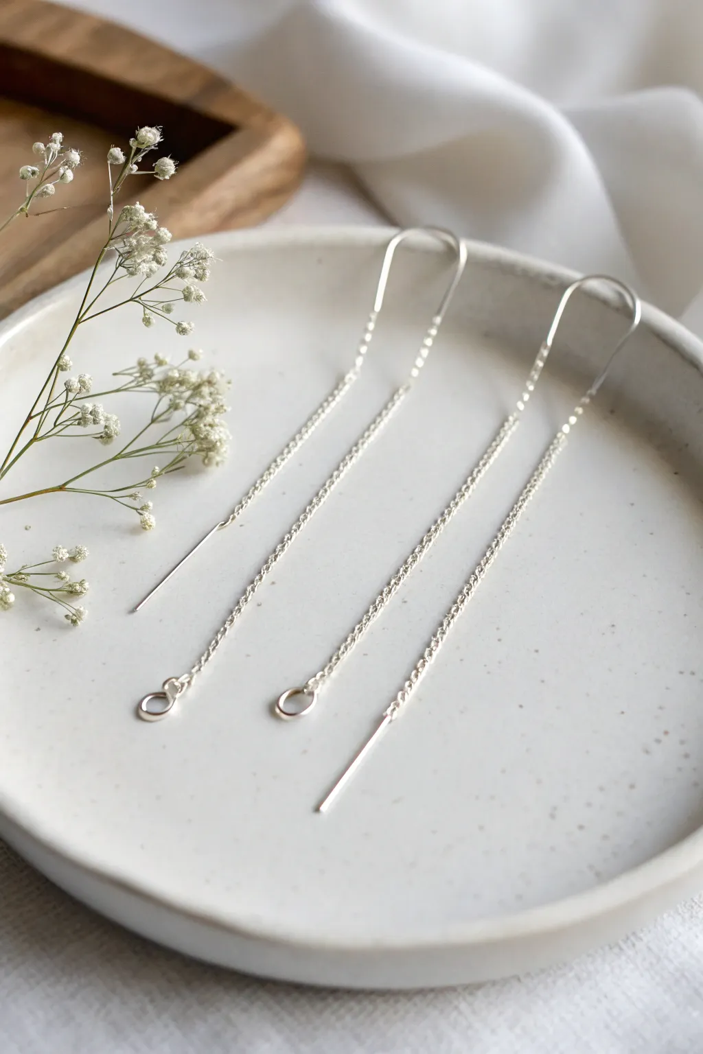 Minimalist threader earrings that add a touch of elegance.