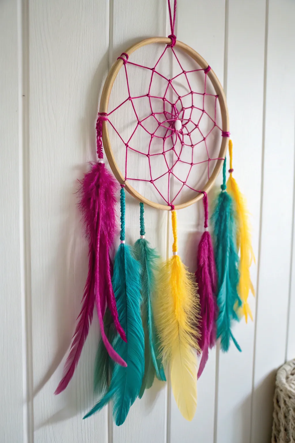 Add a pop of color to your space with this bold DIY dream catcher!
