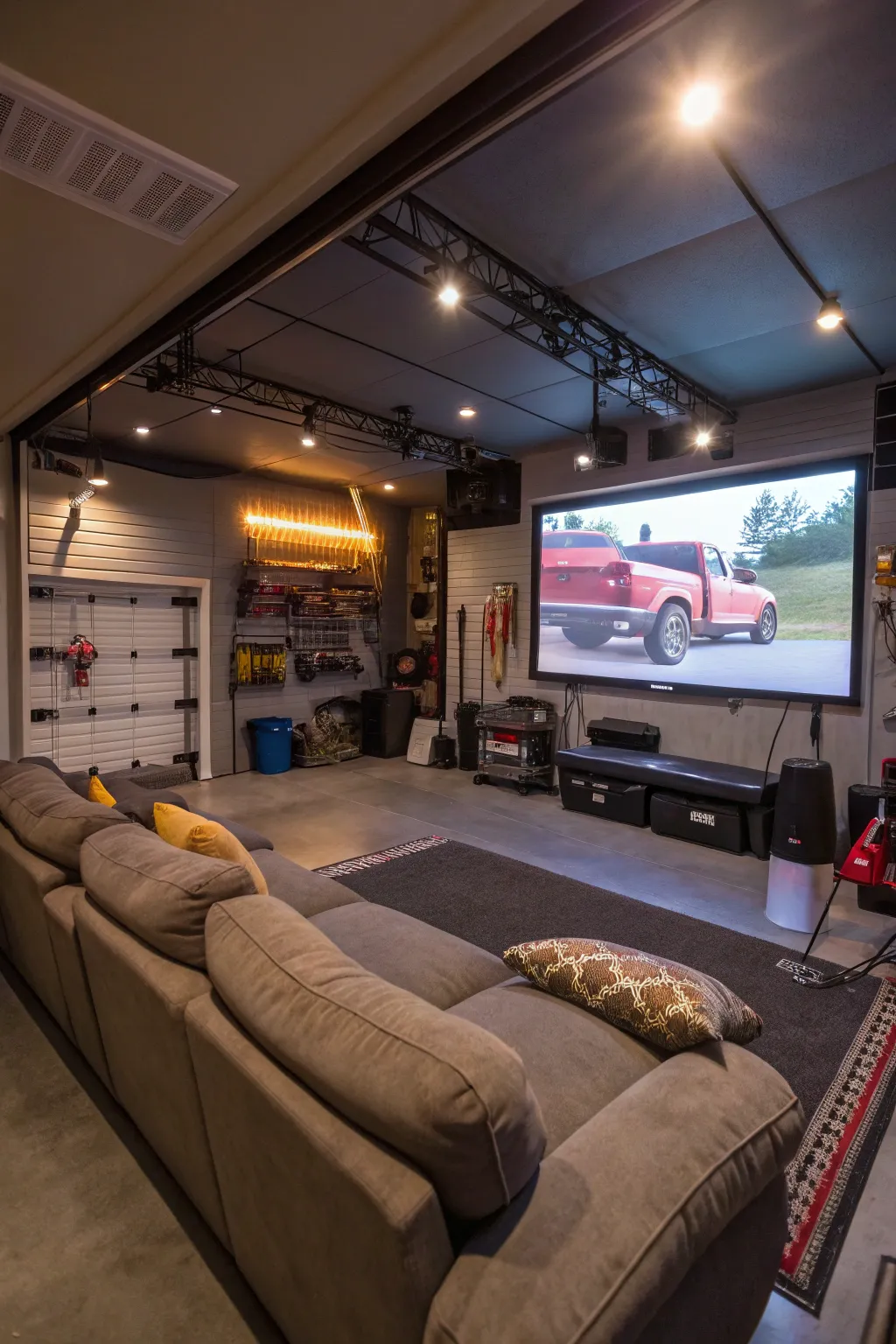 A garage transformed into an entertainment area with comfortable seating.