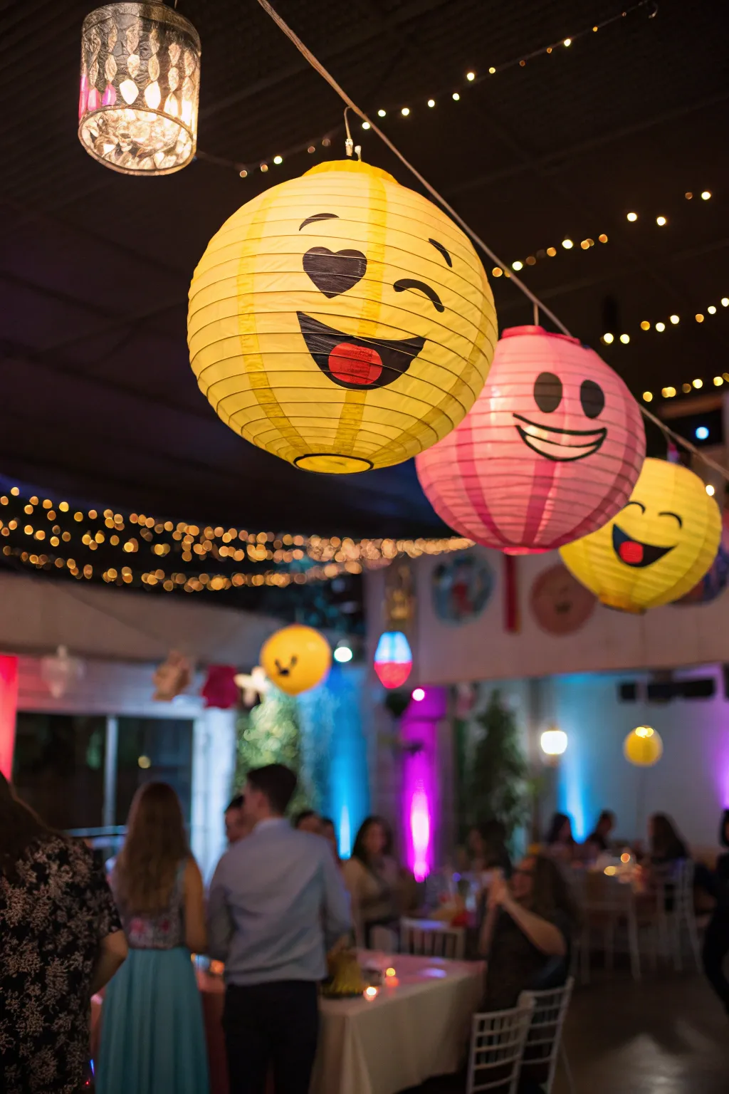 Creative emoji lanterns adding a whimsical touch to the decor.