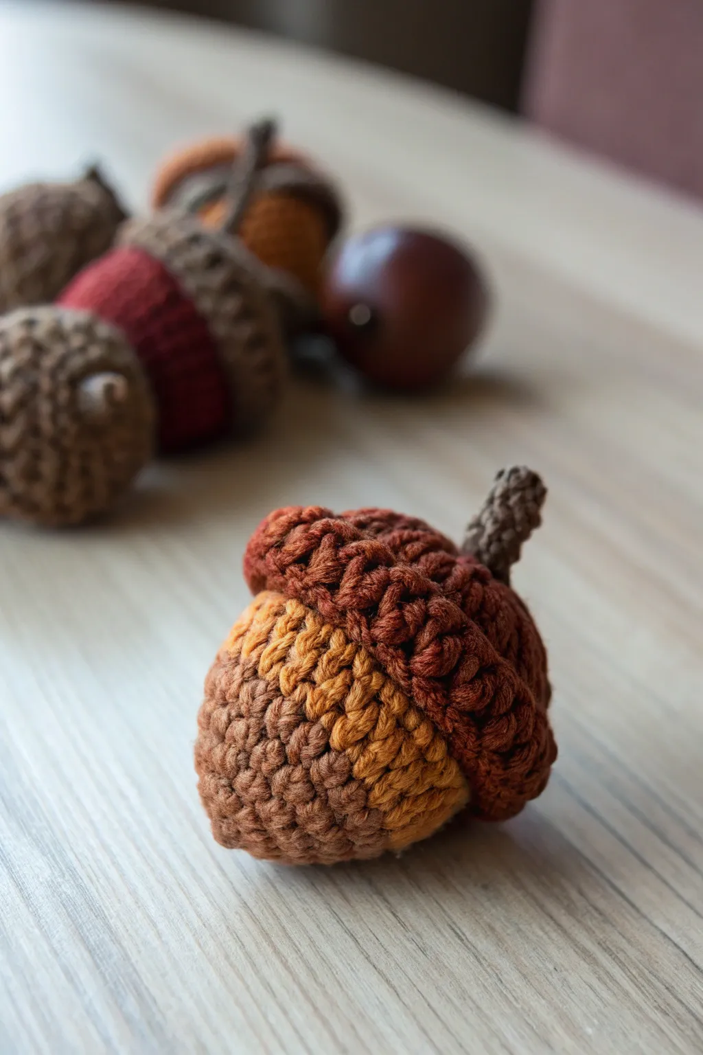 Delight in the charm of autumn with handcrafted crochet acorns, a perfect blend of simplicity and elegance for your seasonal decor.