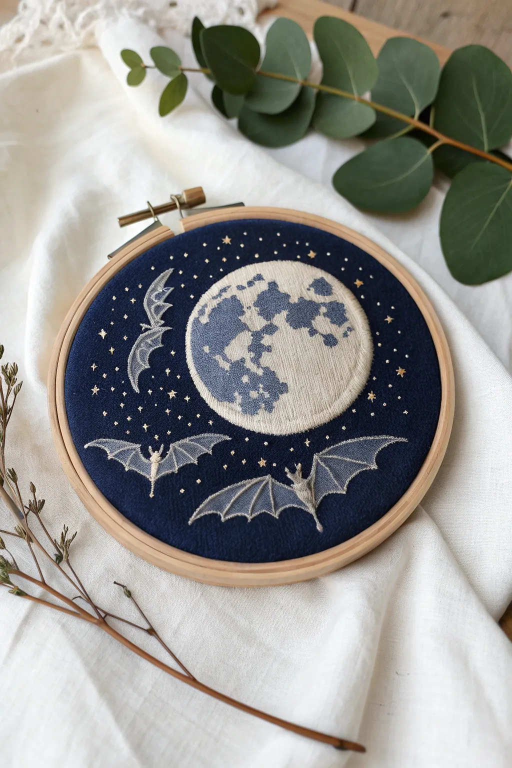 Craft a piece of the night sky with this enchanting full moon embroidery. Perfect for adding a touch of mystery to any space.