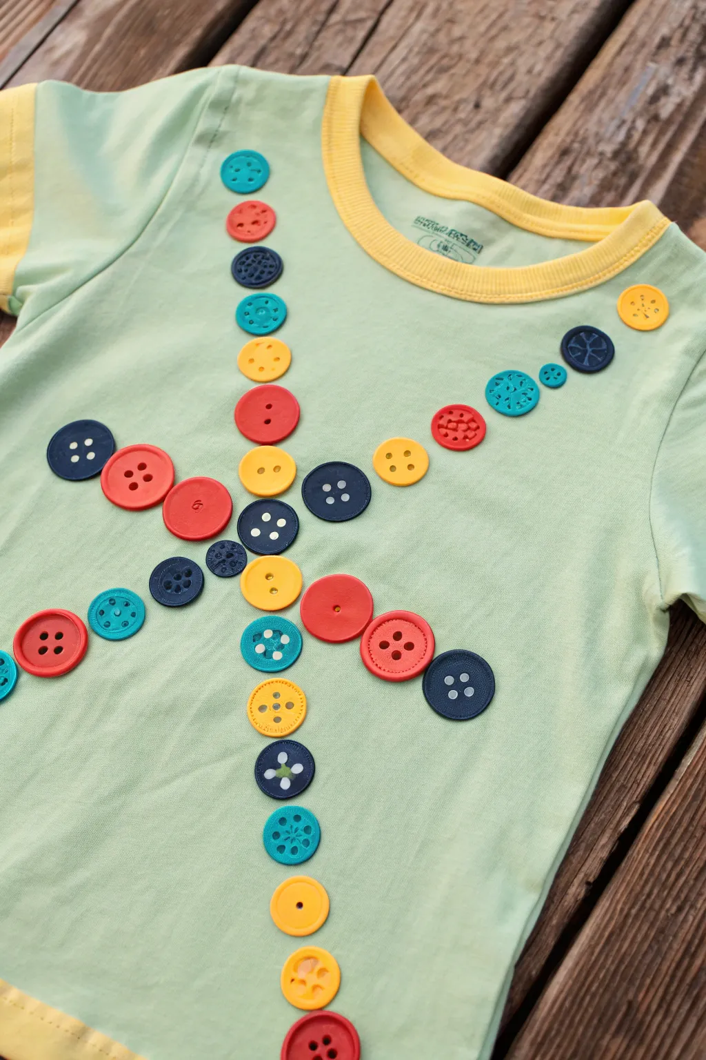 Transform a simple tee into a playful masterpiece with a Button Bonanza!