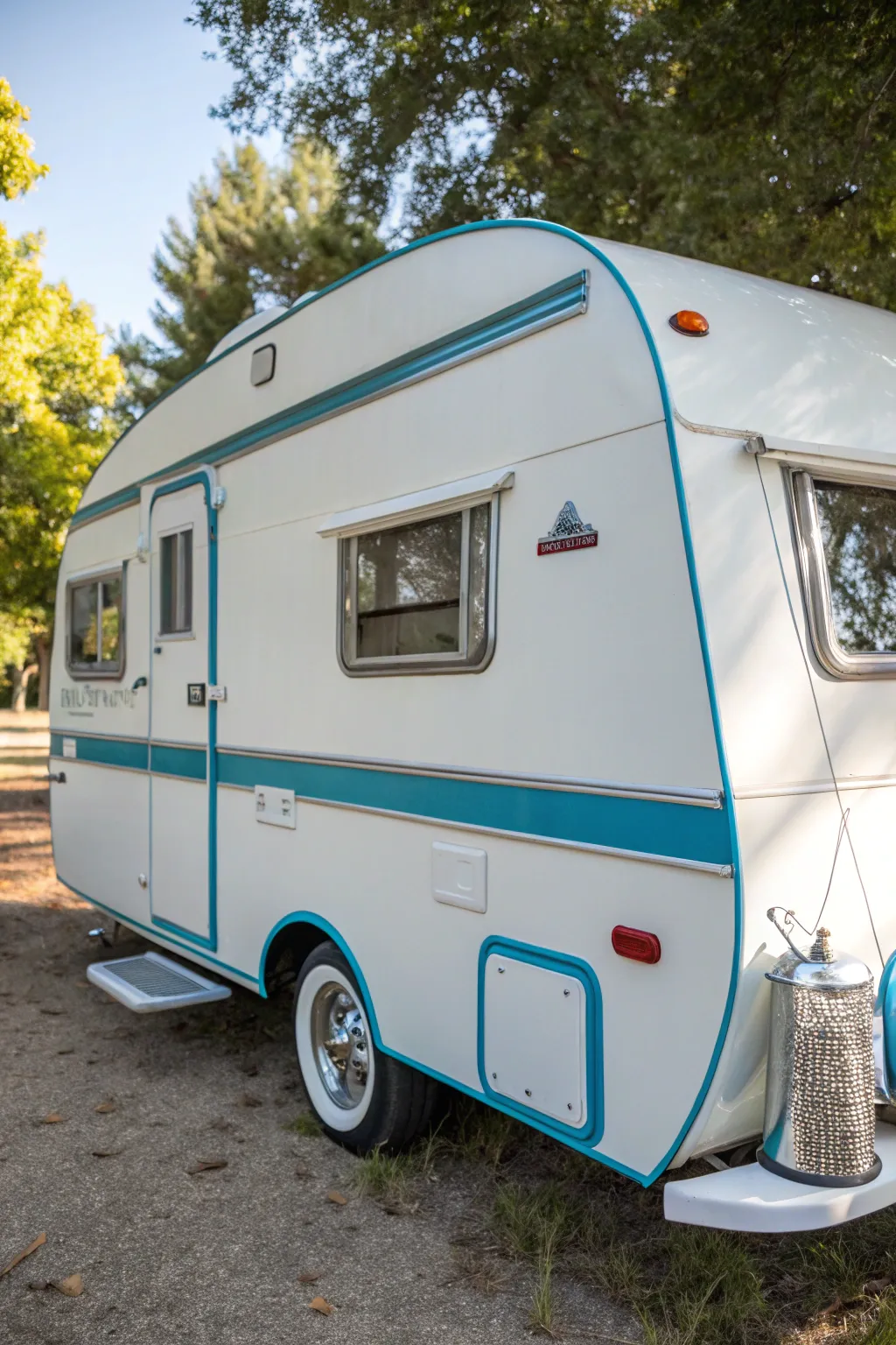 Elevate your travel style with a timeless white and blue pop-up camper design.