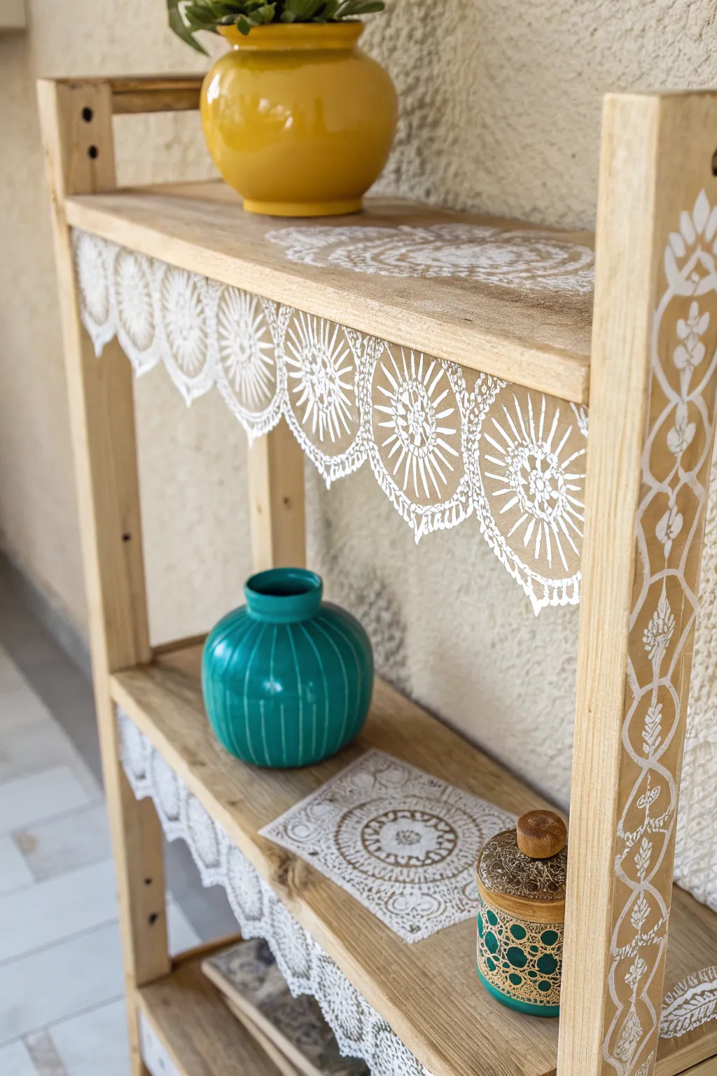 Transform your shelves with delicate lace stencils for a touch of minimalist elegance.