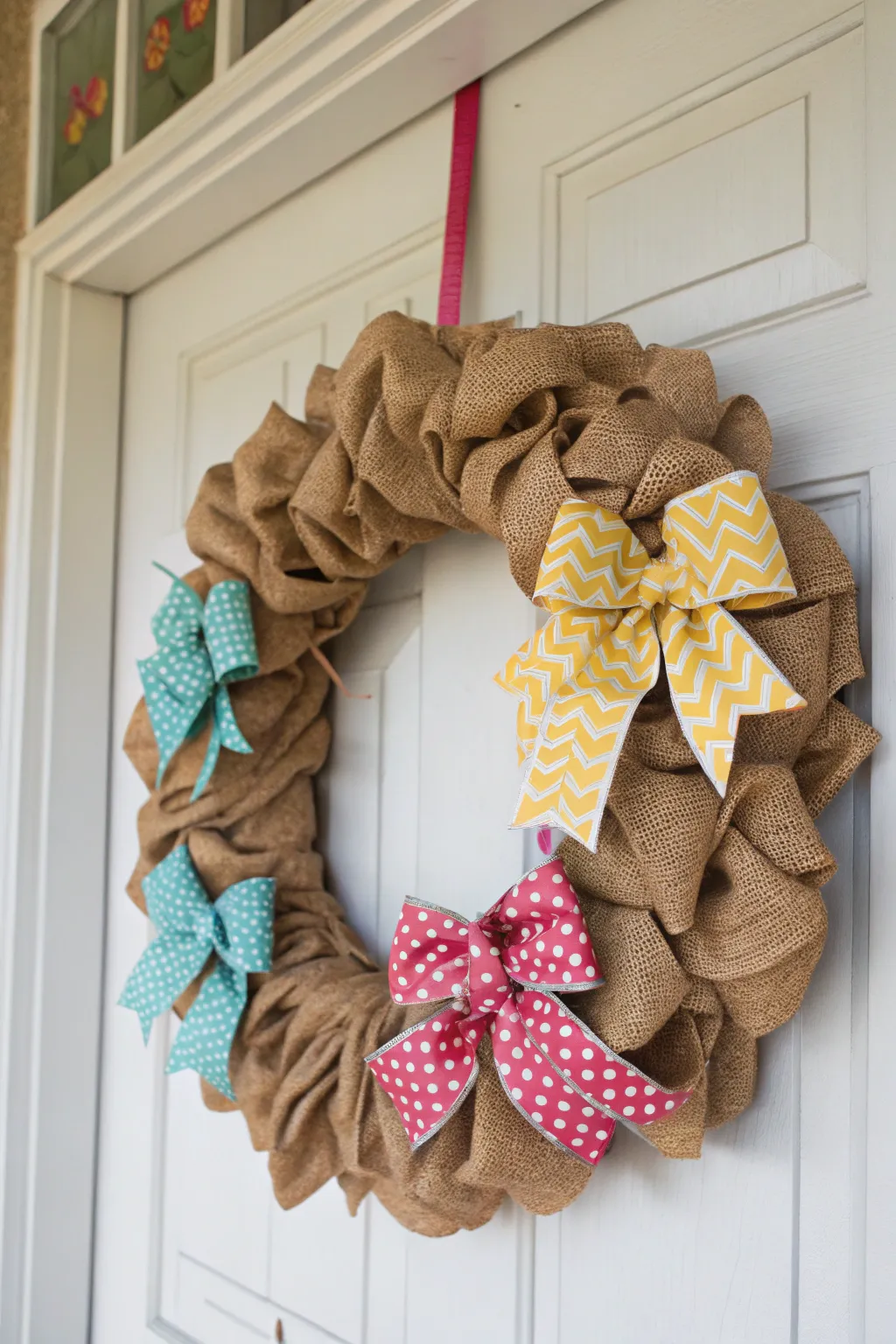 Playful bows provide a burst of color to this burlap wreath.