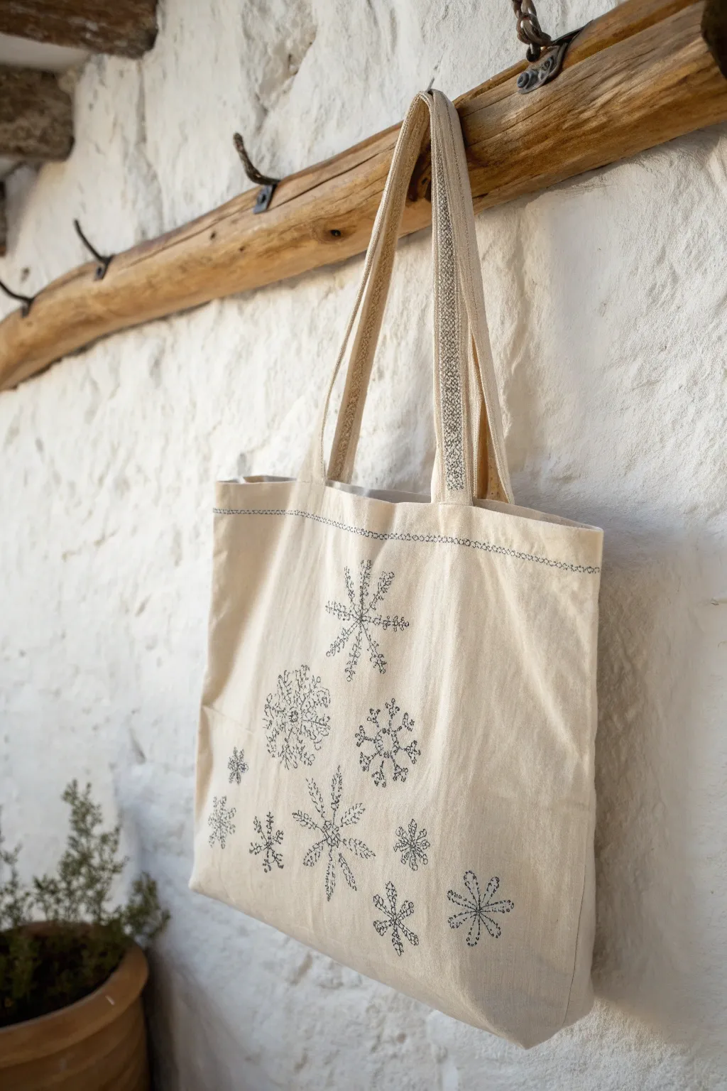 Embrace the charm of winter with a tote that celebrates the season's subtle elegance.