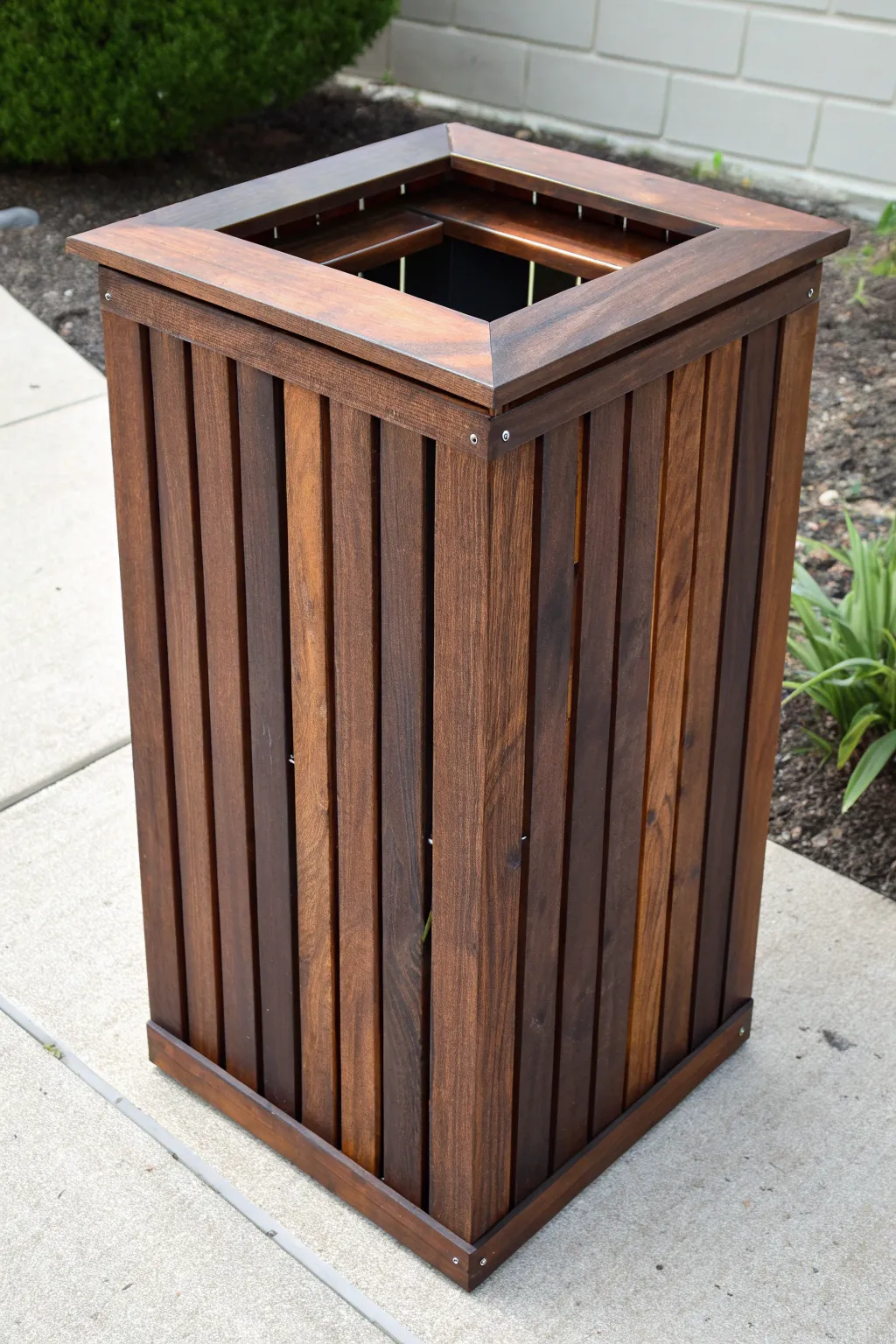 Elevate your outdoor space with this sleek slatted trash can cover—where craftsmanship meets modern style.