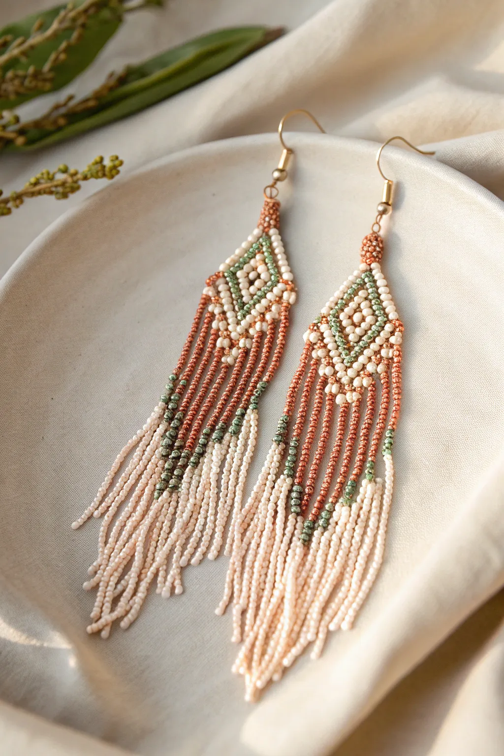 Add a touch of elegance and flair to your look with these stunning seed bead fringe earrings.