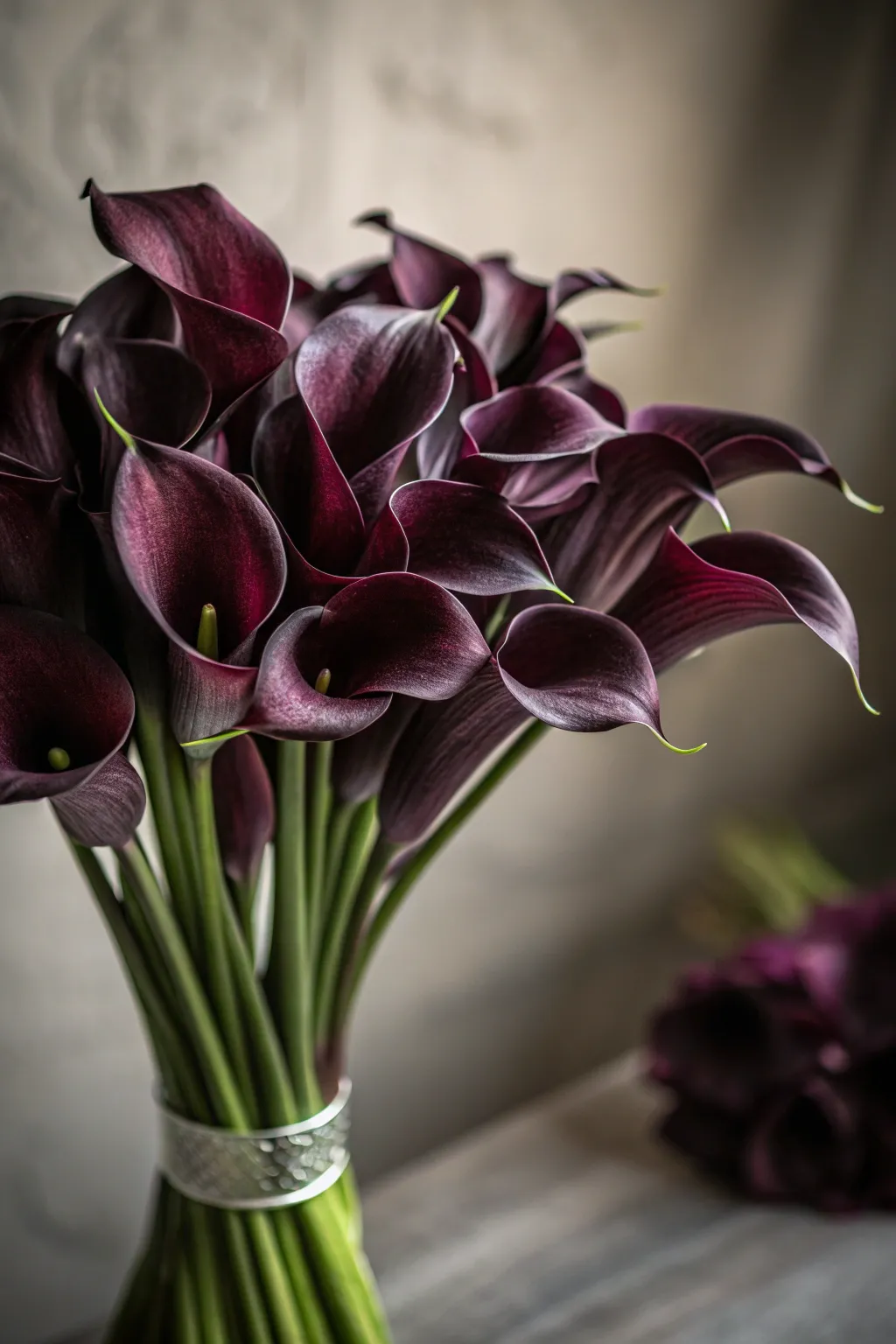 Moody romance with dark calla lilies.