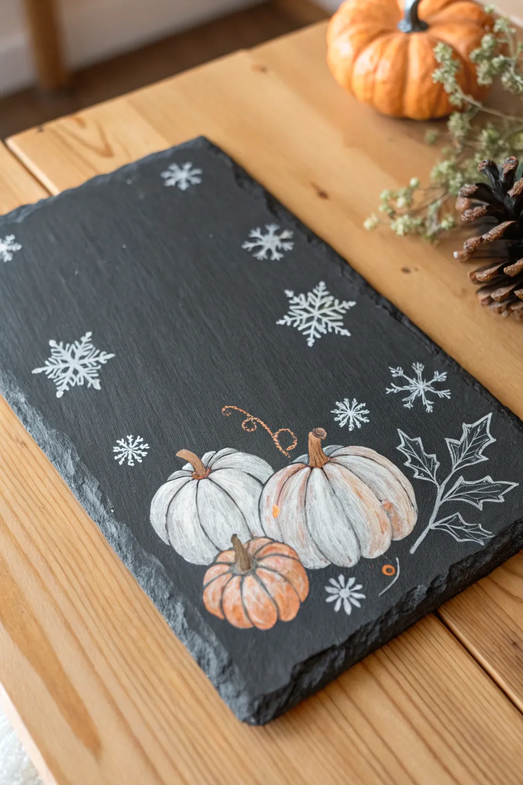 Embrace the seasons with handmade slate art, where simplicity meets natural beauty.