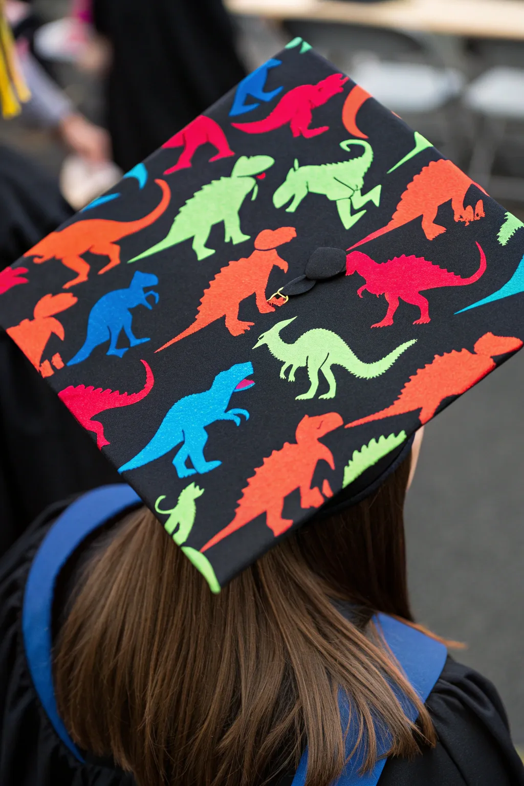 Stand out with a vibrant Dino Collage graduation cap, where creativity meets craftsmanship.