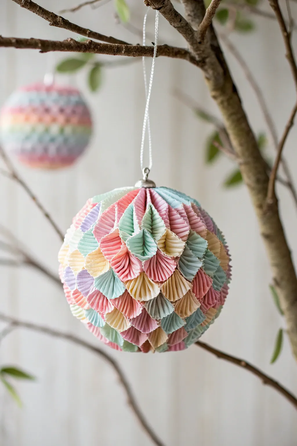 Transform cupcake liners into charming ornaments that add a splash of color and creativity to your decor.