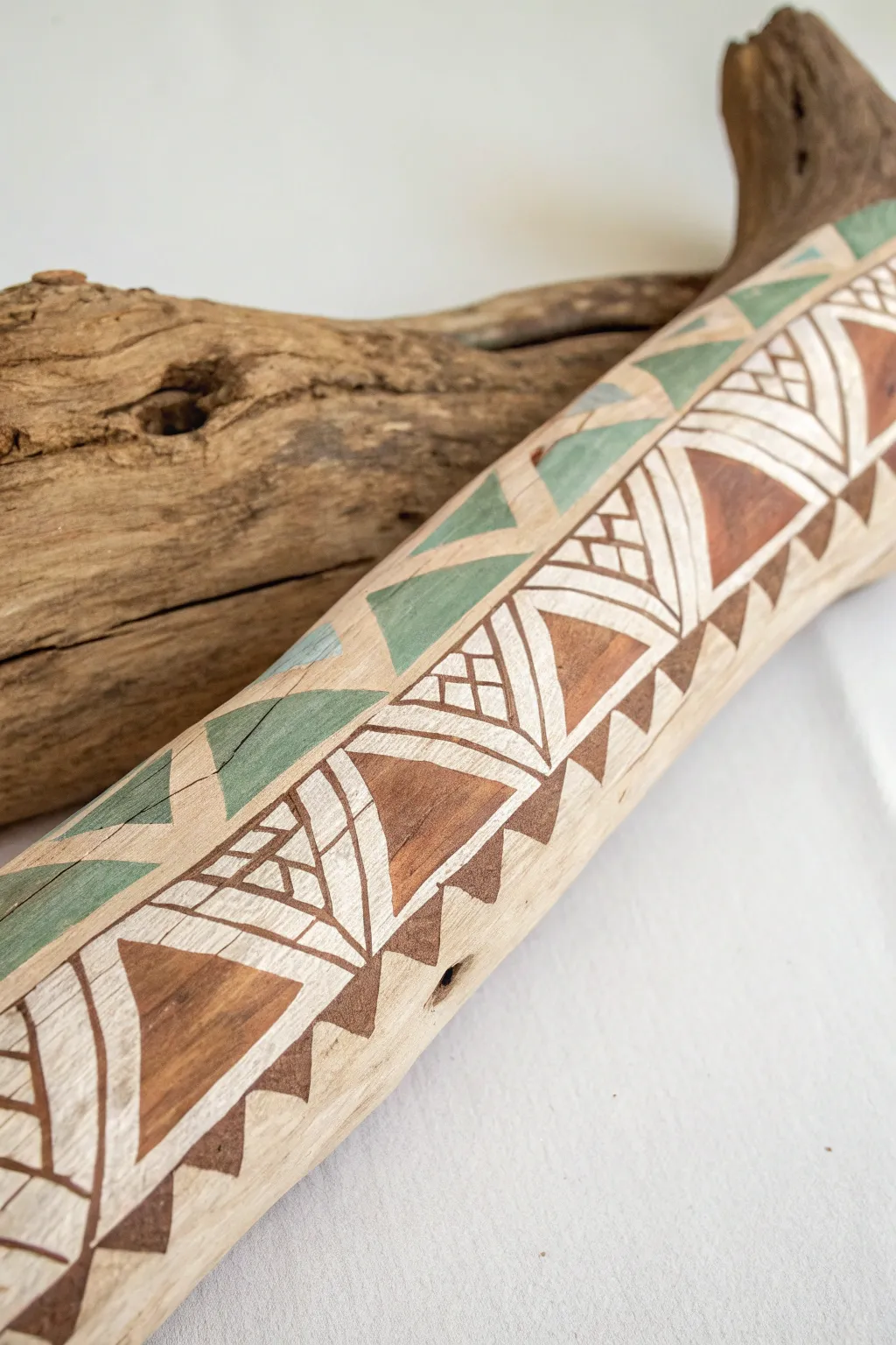 Transform driftwood into art with modern geometric patterns for a chic, minimalist touch.