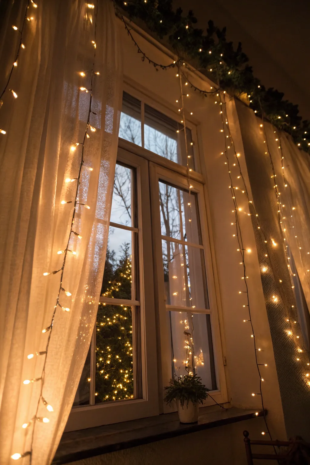 Twinkling lights create a magical fall window ambiance.