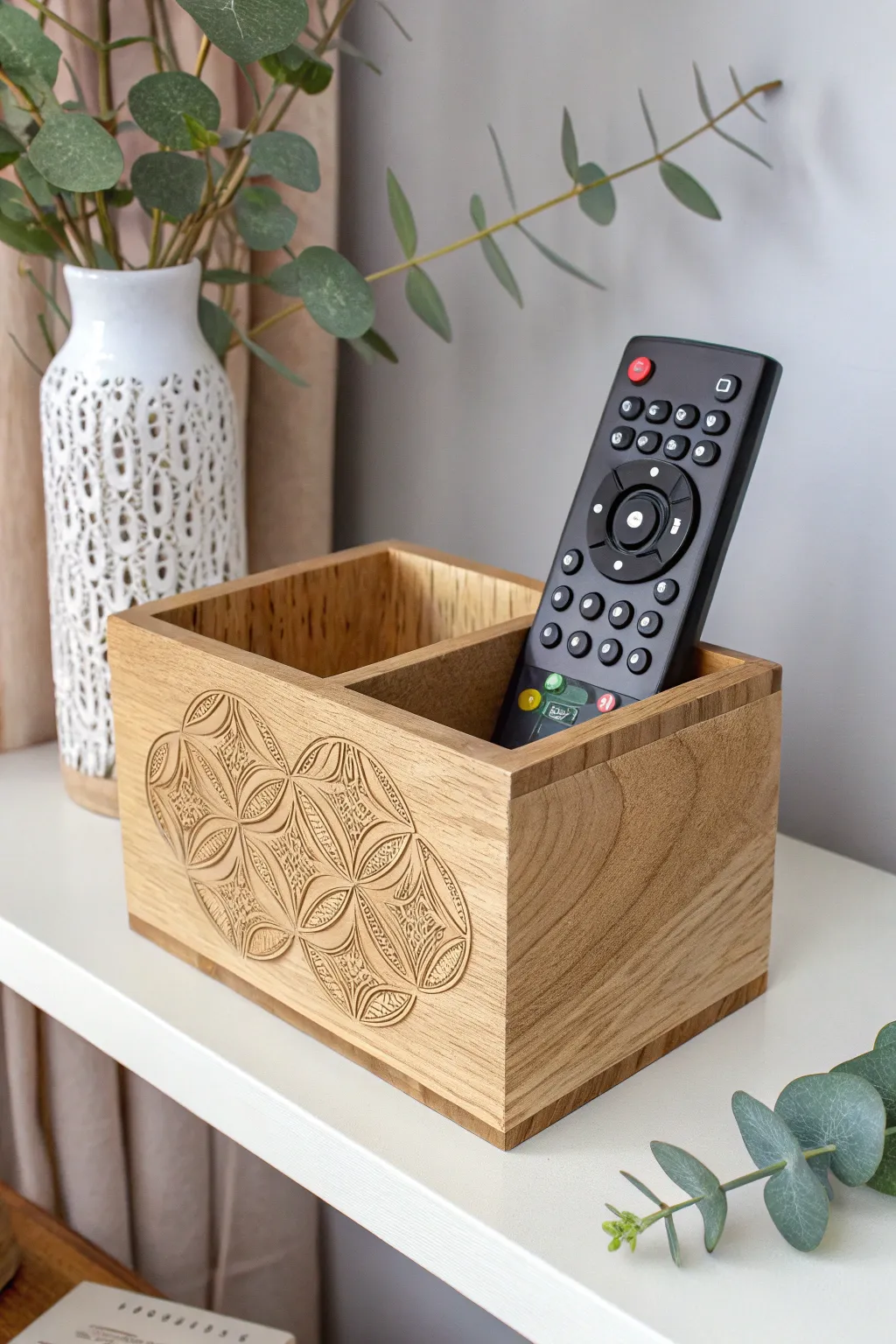 Transform your treasures: A jewelry box finds new life as a chic remote control holder.