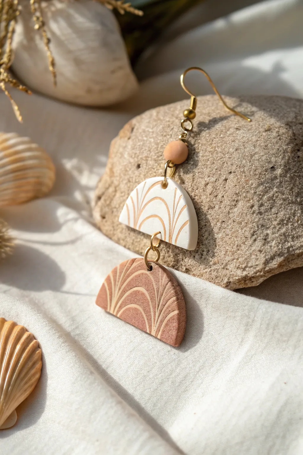 Discover the beauty of nature-inspired textures with these elegantly layered polymer clay earrings.
