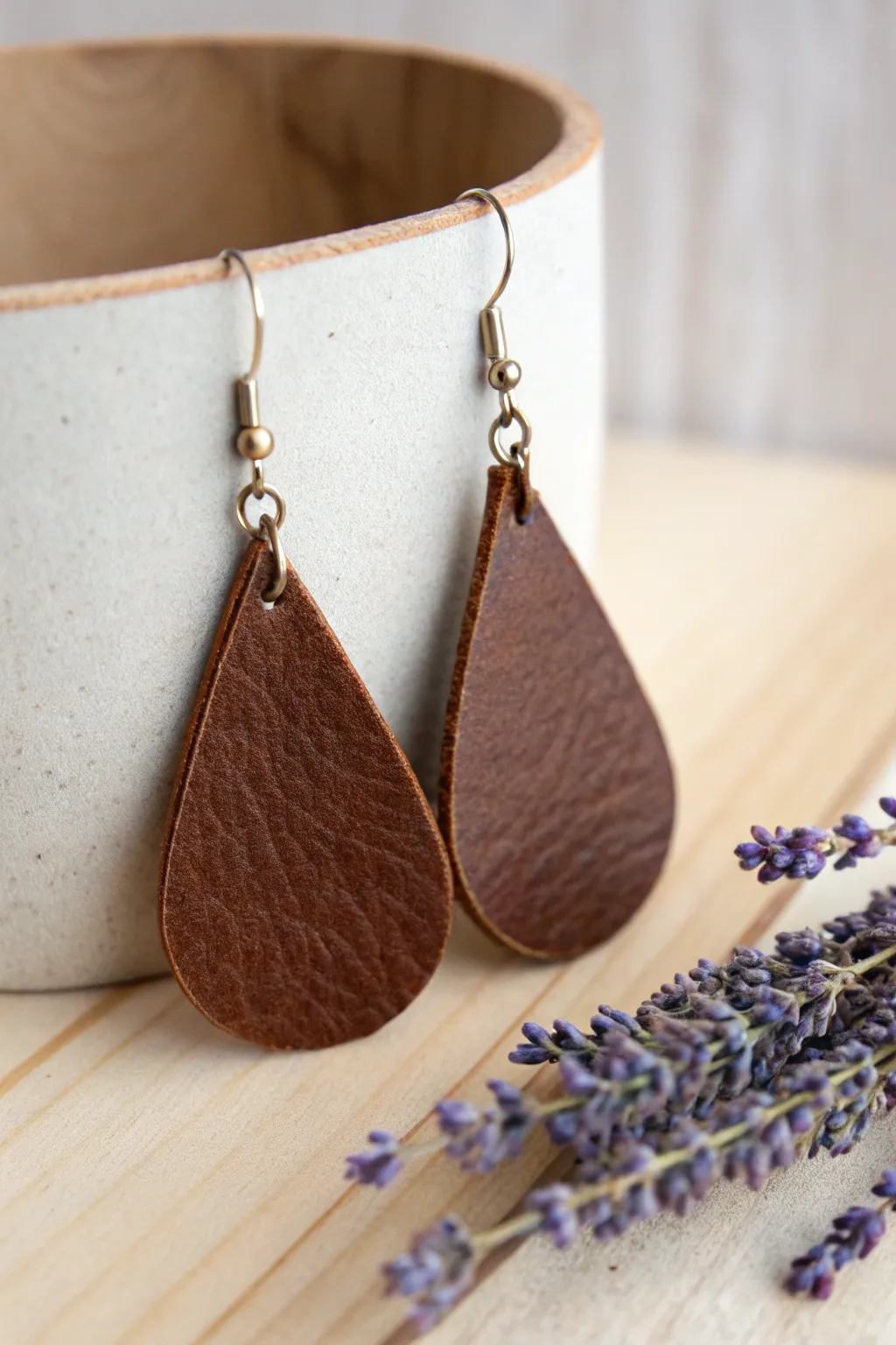 Elevate your style with eco-friendly elegance: Recycled leather earrings that blend simplicity and sophistication.