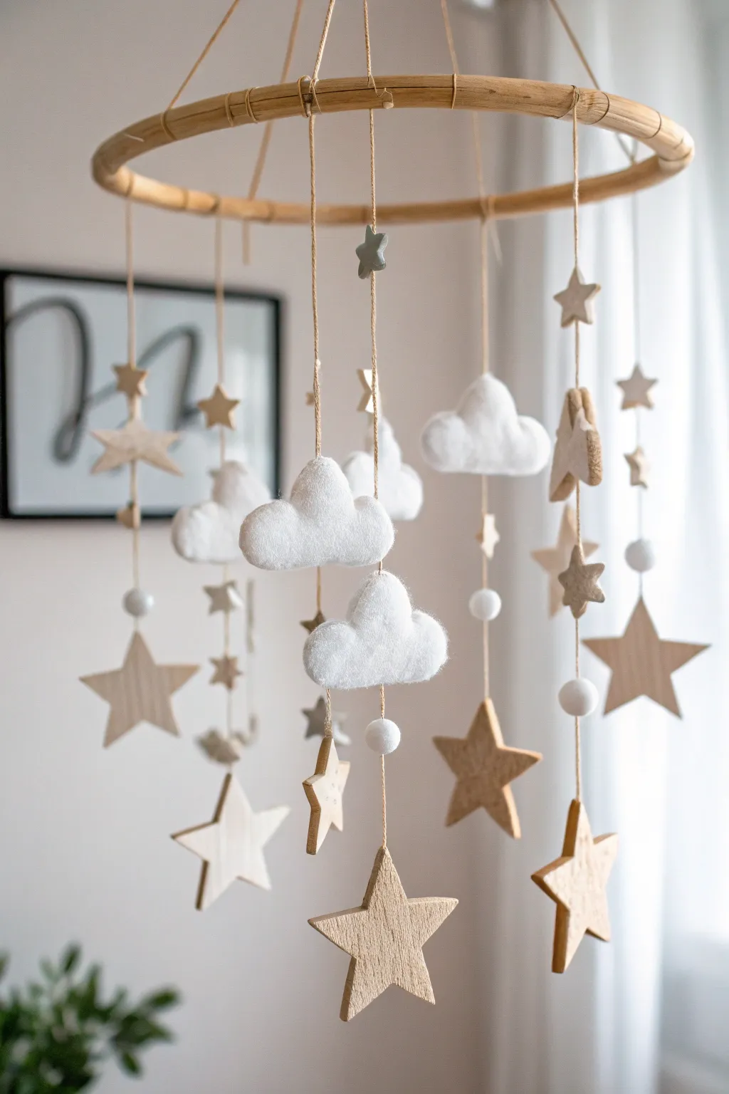 Create a dreamy escape for your little one with this enchanting star and cloud mobile. 🌟☁️ #NurseryDecor #ScandiBoho