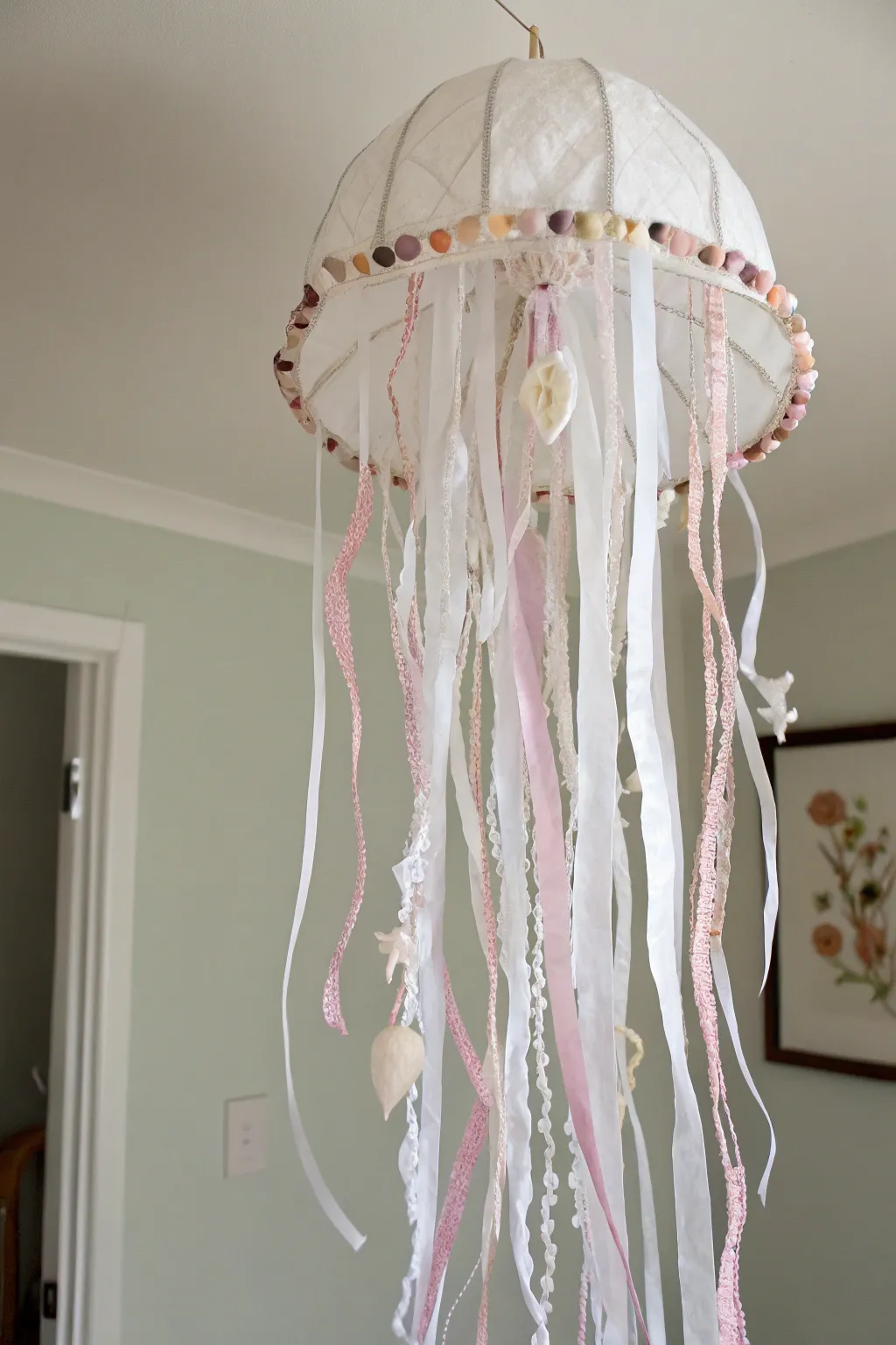 Elevate your space with this ethereal ribbon jellyfish, blending minimalist elegance with a hint of boho charm.