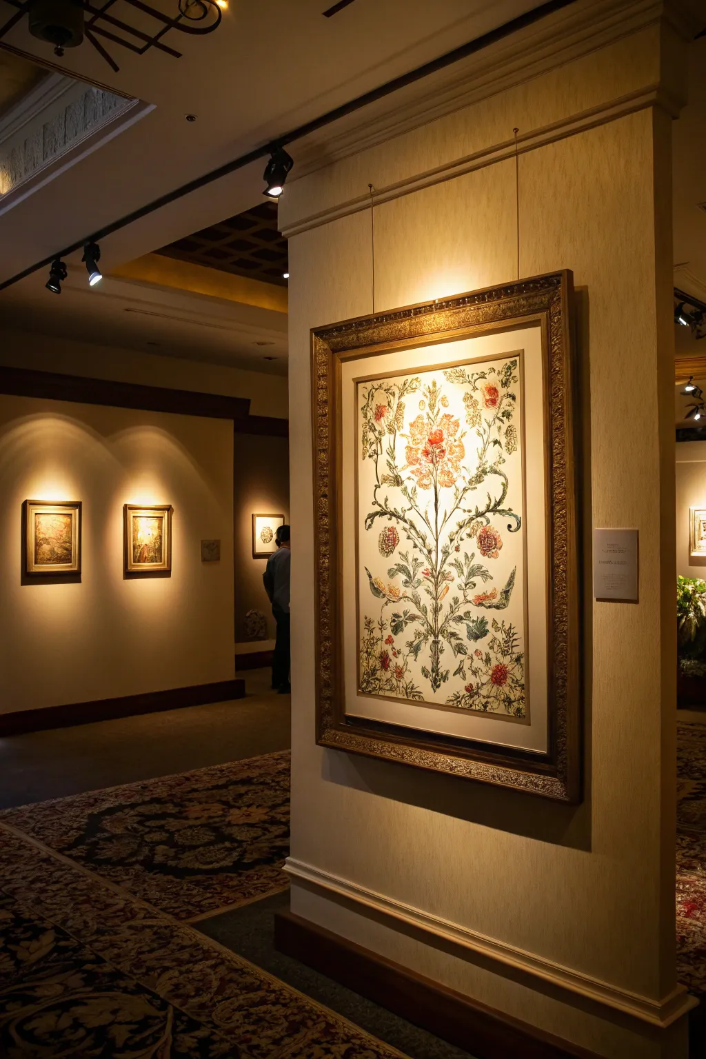 Artwork highlighted with strategic lighting.