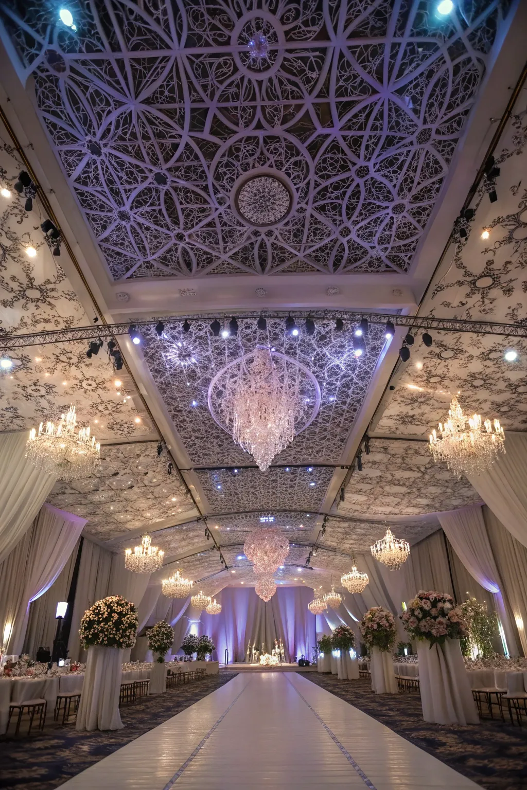 Ceiling installations with lighting create a grand and eye-catching atmosphere.
