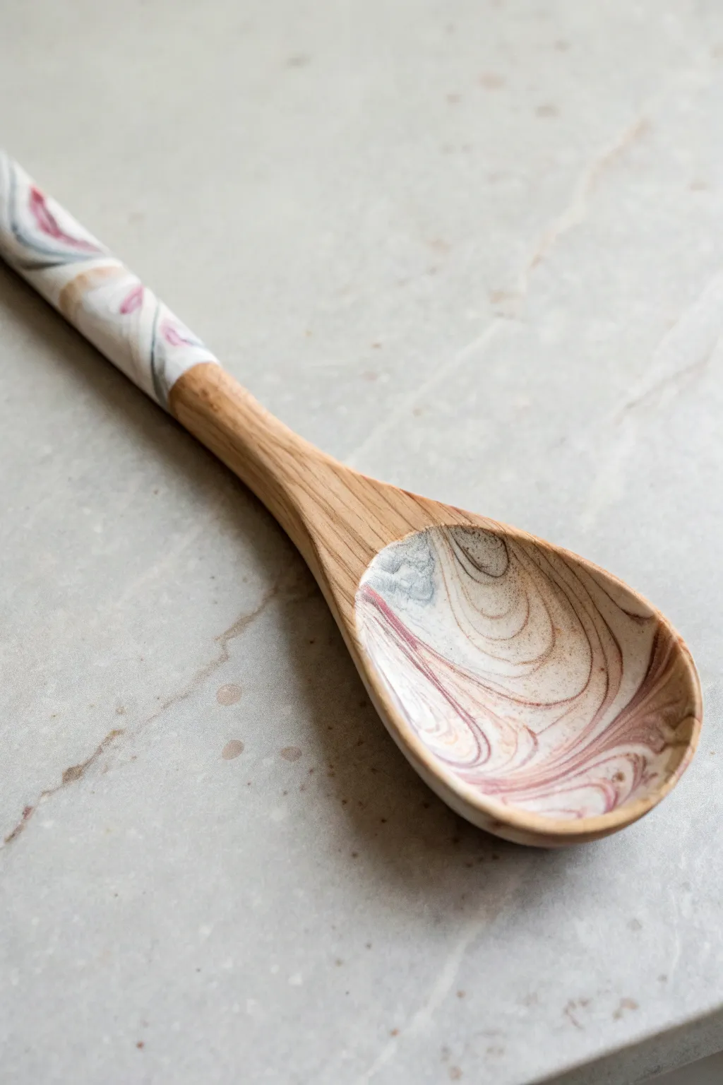 Elevate your kitchenware with the enchanting simplicity of marbled wooden spoons.