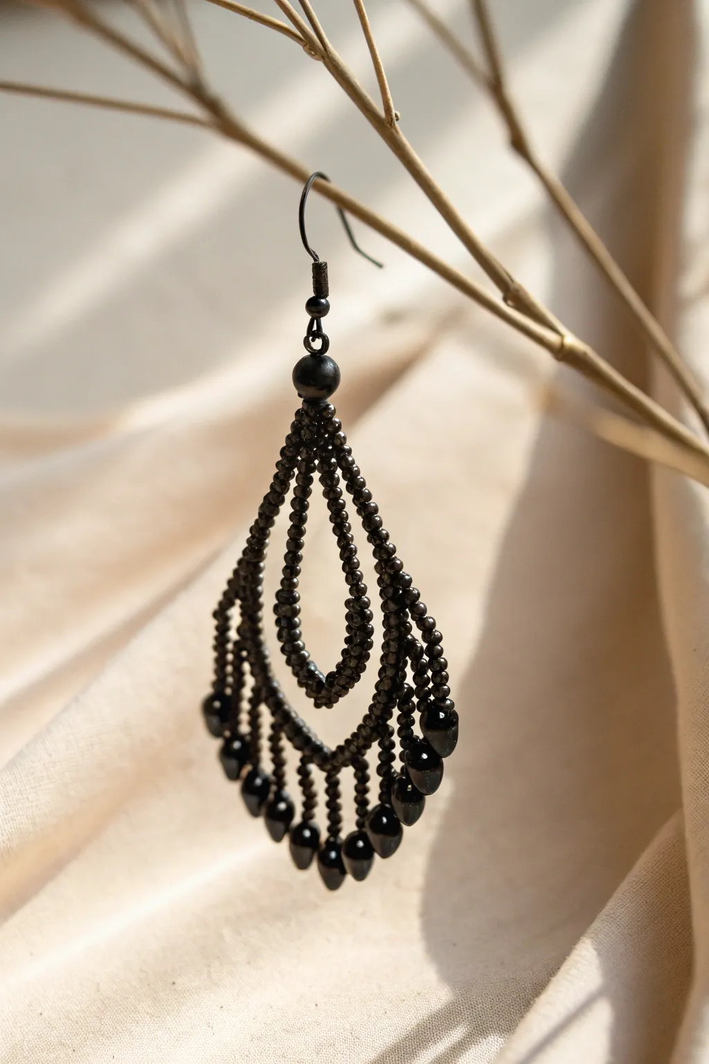 Discover the allure of monochrome elegance with this handcrafted black beaded earring.