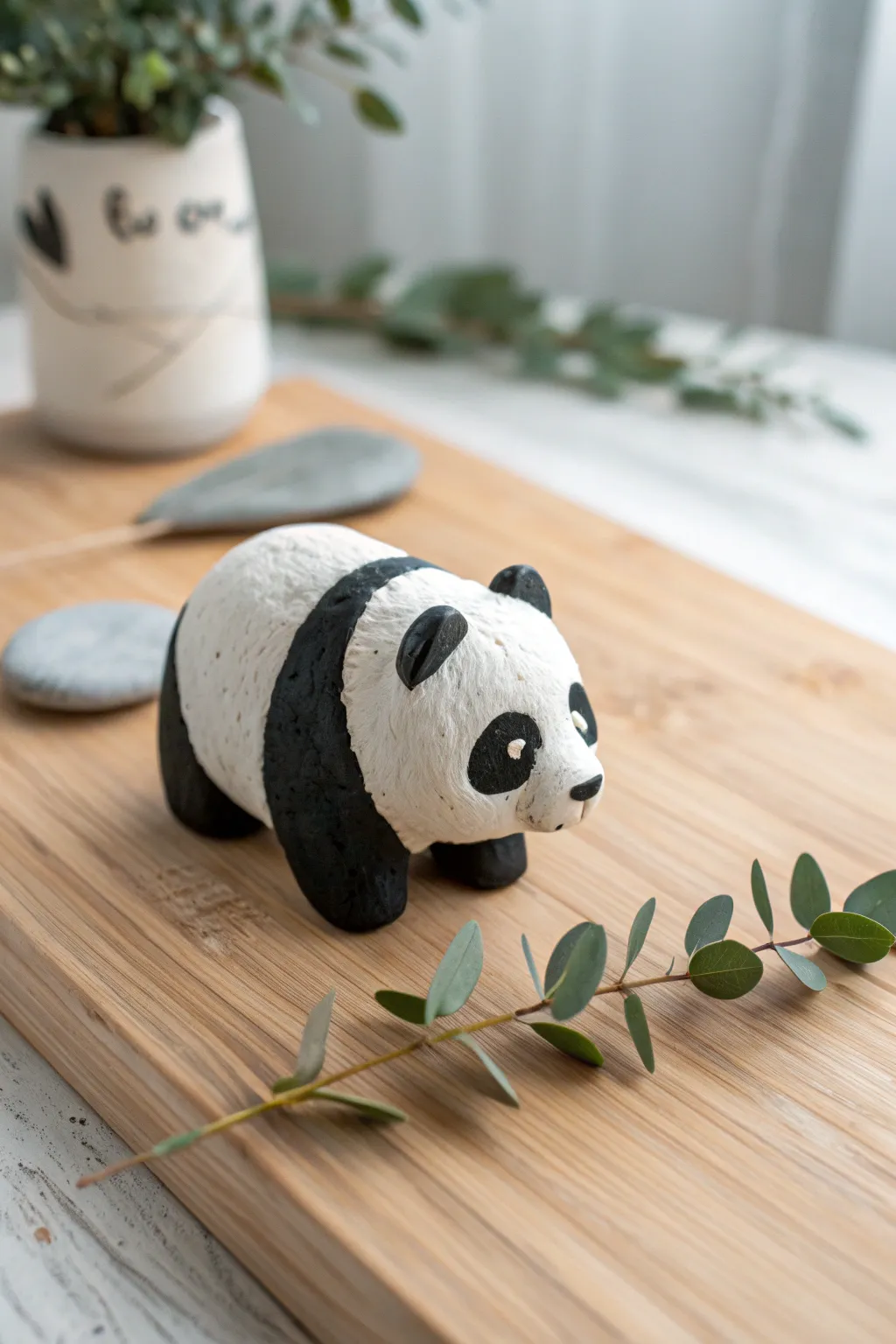 Embrace the charm of handmade simplicity with this adorable clay panda.