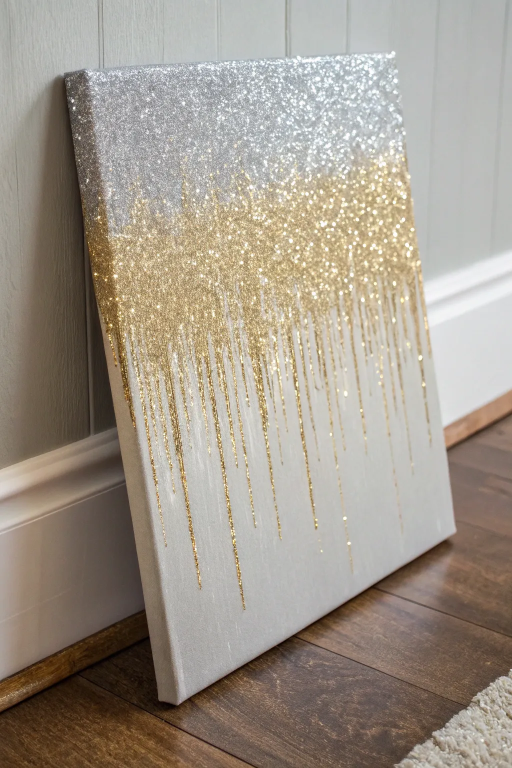 Elevate your space with the enchanting allure of gradient glitter drips, where silver meets gold in a dance of minimalist elegance.