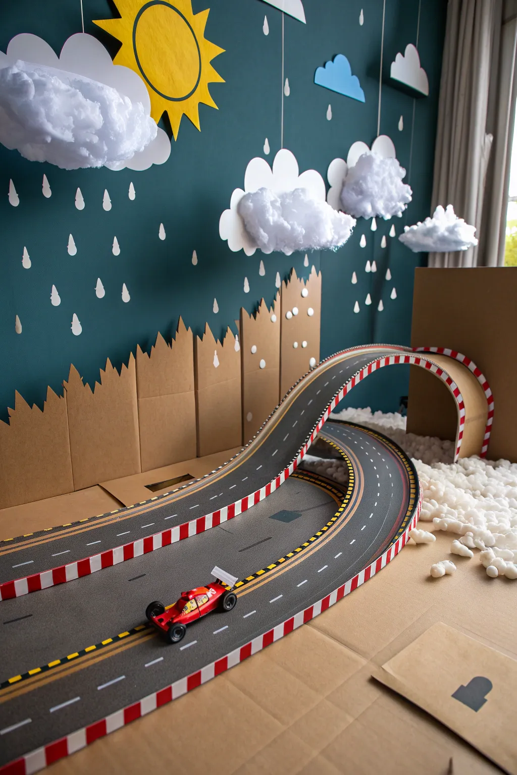 Rev up the creativity! Transform your cardboard race track with playful weather elements for an exhilarating race day atmosphere. 🌦️☀️