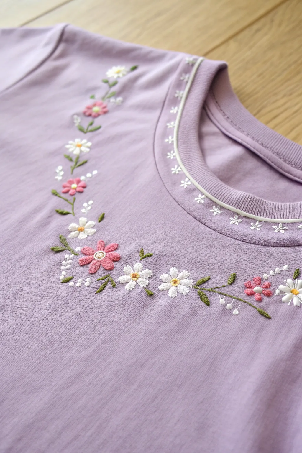 Elevate your style with delicate embroidery accents that add a personal touch of charm to any t-shirt.