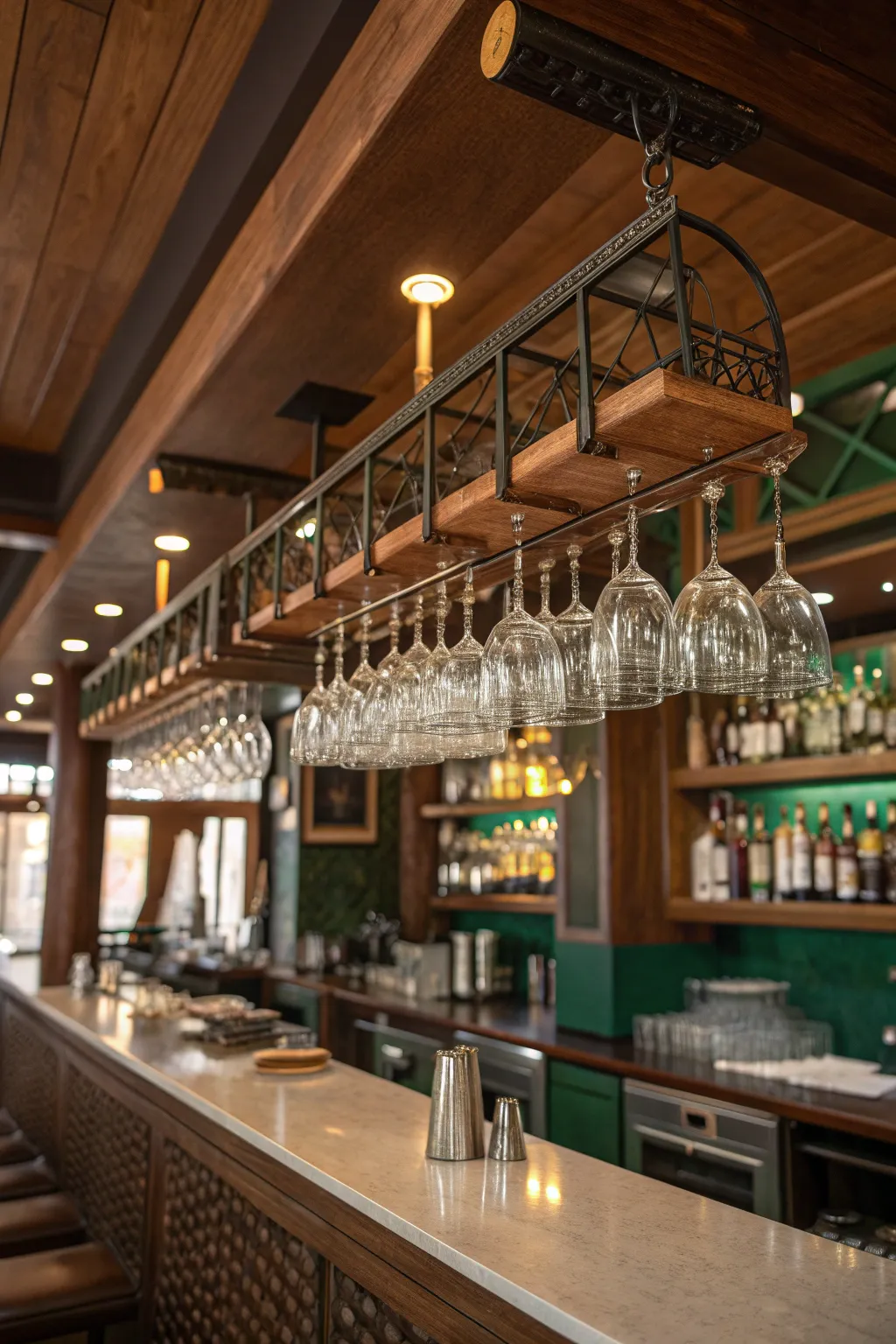 Impress guests with suspended glassware that adds magic and functionality to your bar. ✨ #BarMagic #CreativeStorage