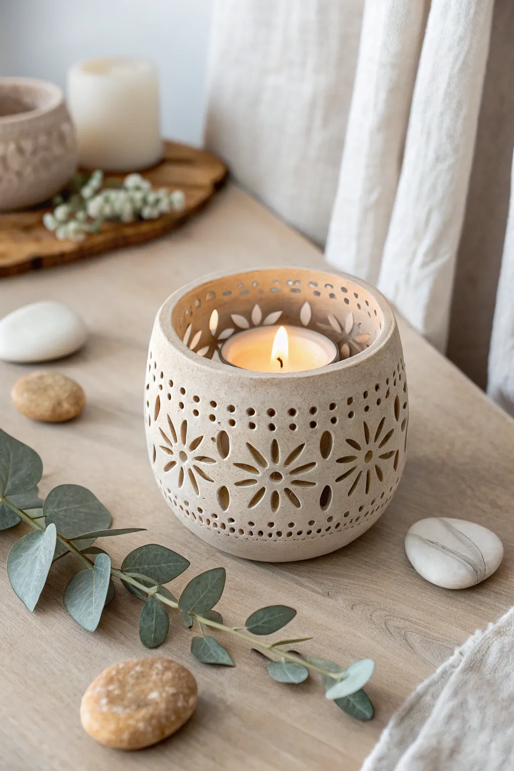Illuminate your space with the serene beauty of handcrafted clay candle holders.