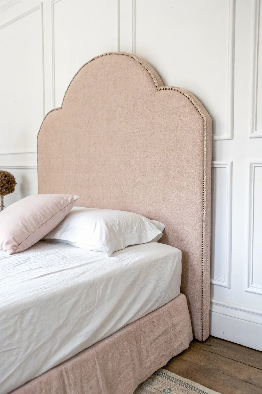 Transform your dorm room with this chic DIY headboard made from budget-friendly cardboard and cozy fabric. #DormDecor #ScandiBoho