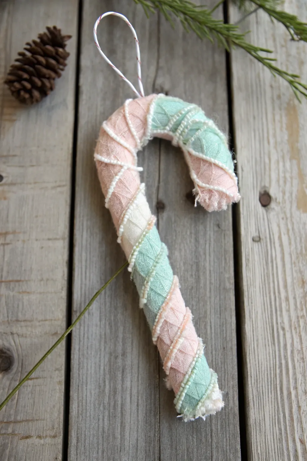 Craft your own sweet holiday magic with these charming DIY candy cane ornaments.
