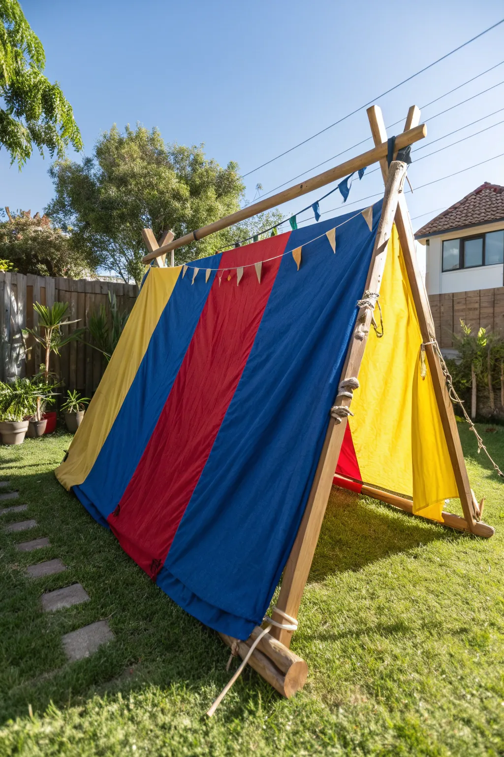 Transform your backyard into a vibrant oasis with a colorful DIY tarp tent—perfect for fun and shade!