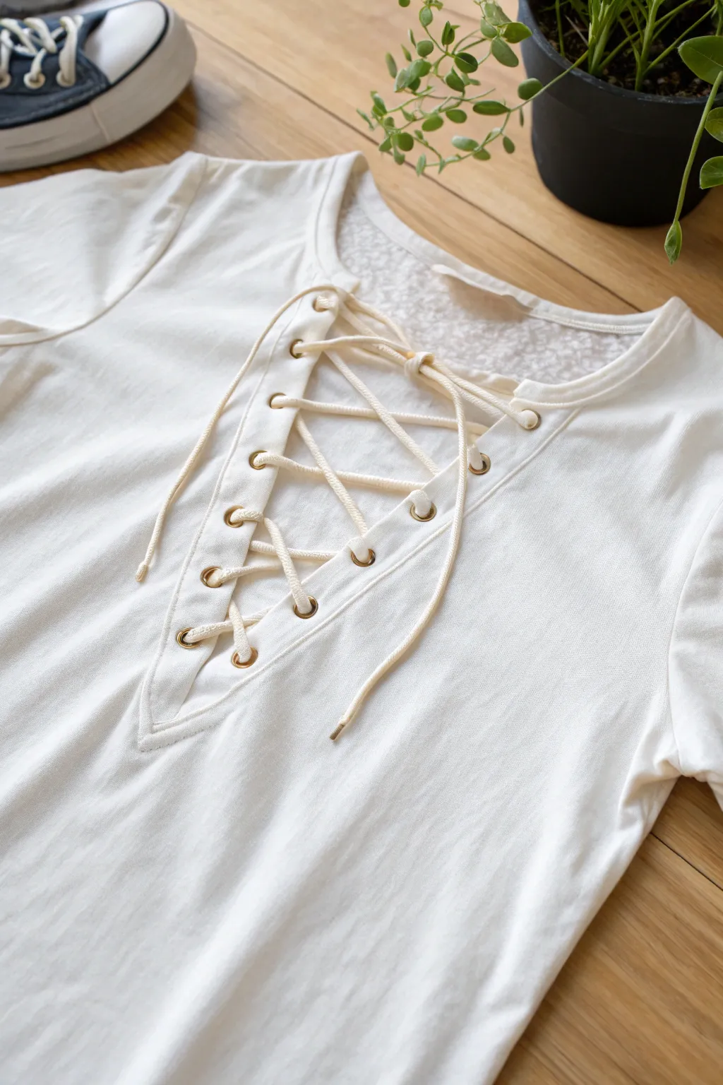 Transform your T-shirt with a romantic lace-up neckline for a chic, boho-inspired look.
