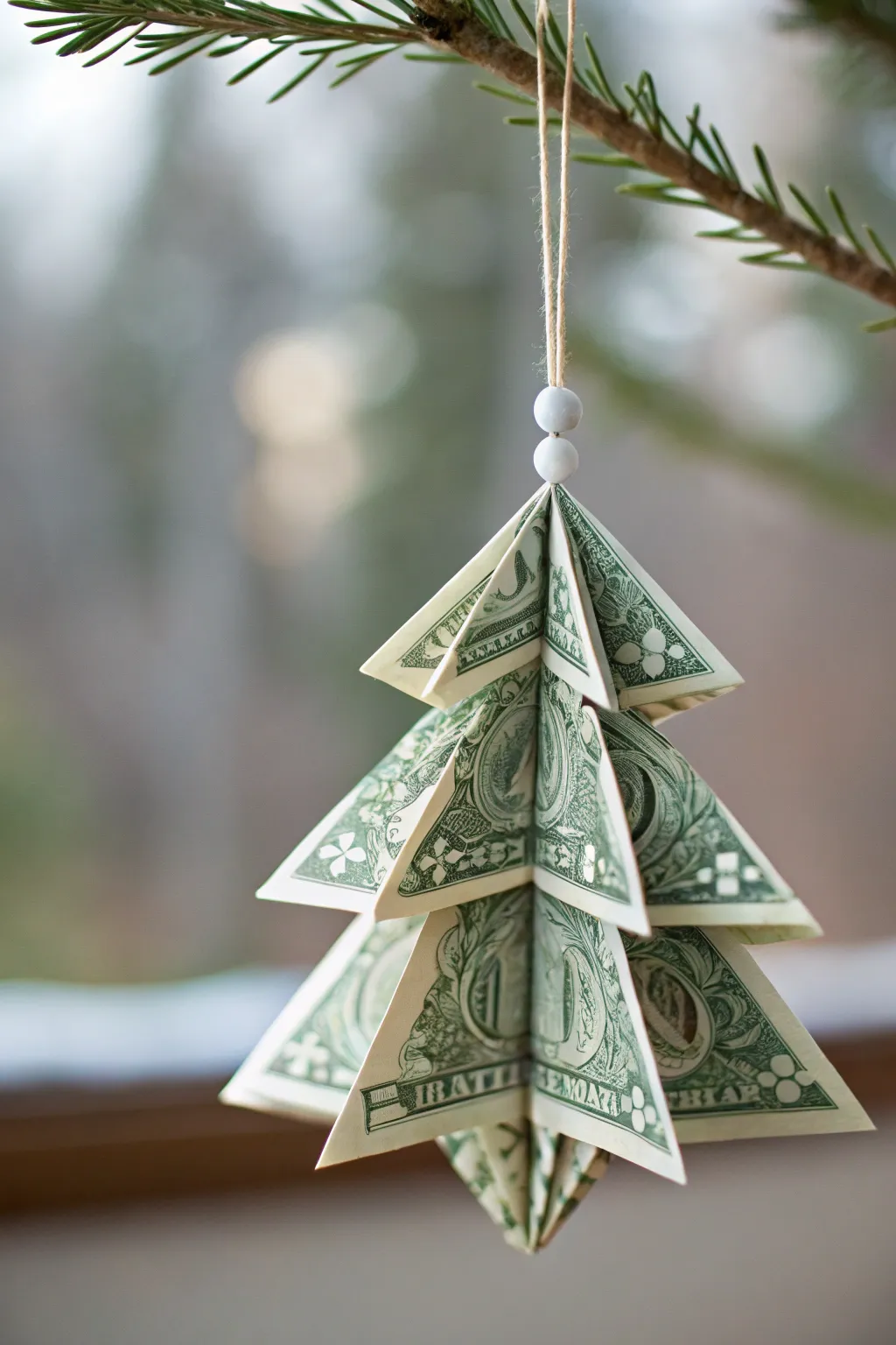 Elevate your holiday decor with a touch of minimalist elegance—discover the art of dollar bill origami Christmas trees.