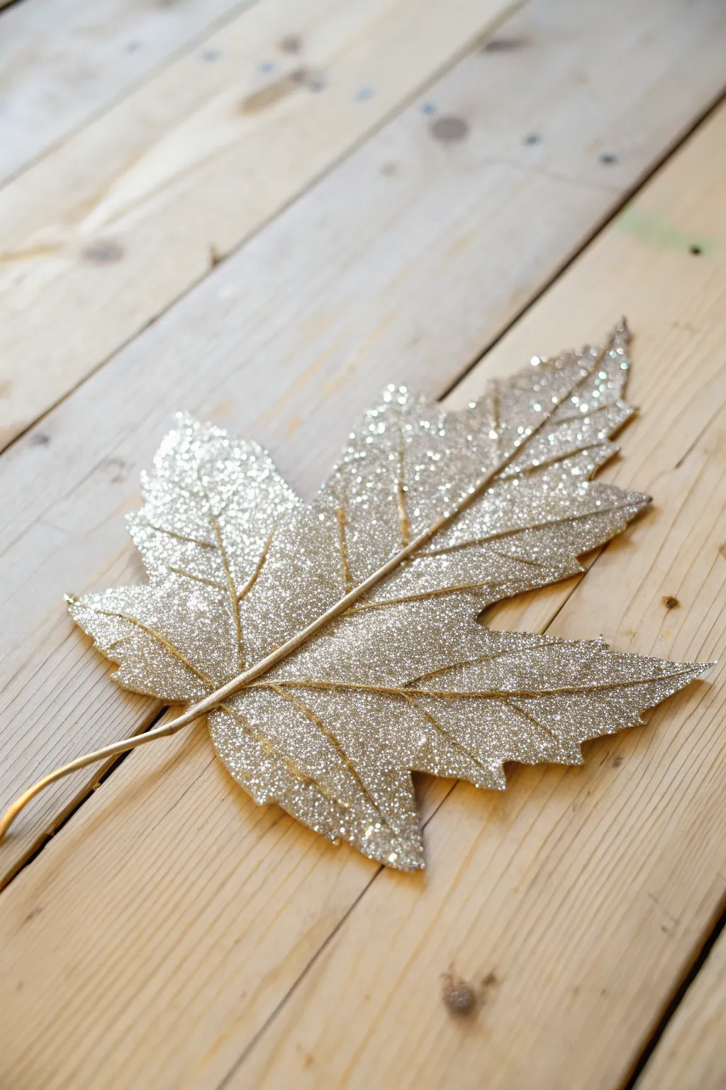 Add a touch of autumn glamour with minimalist glittery leaves.