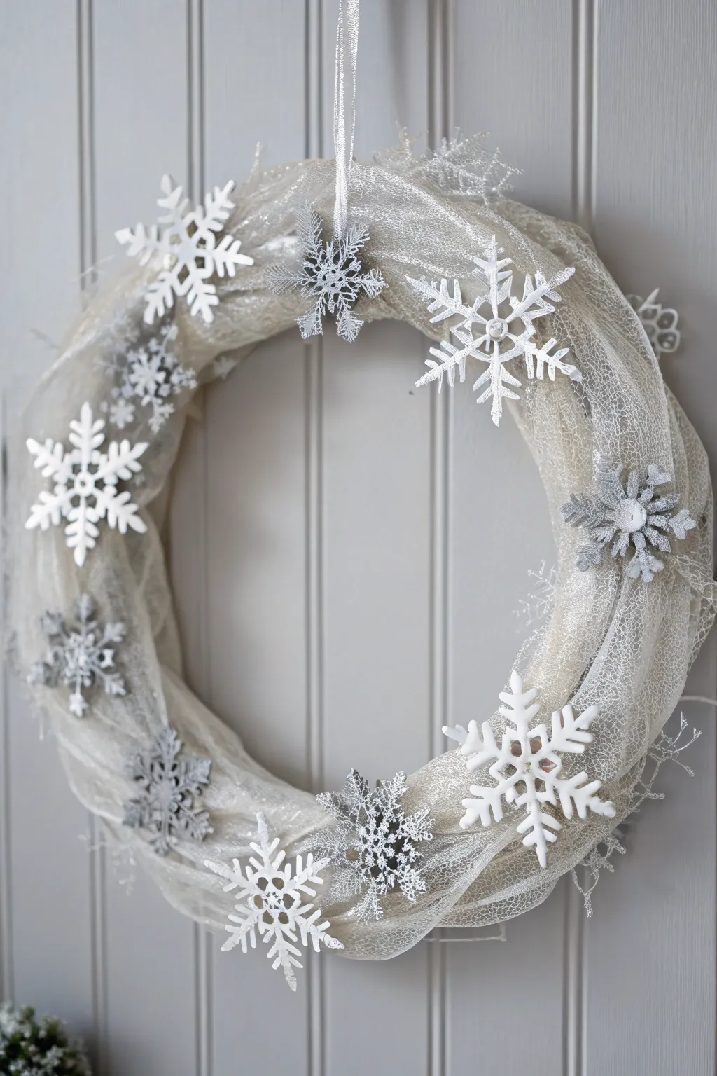 Embrace the serene elegance of winter with this enchanting deco mesh wreath.